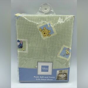 Disney Pooh fitted sheets for a baby crib.